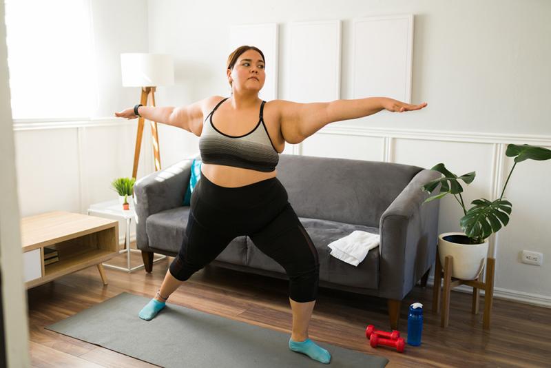 woman doing warrior yoga pose