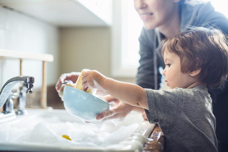 mom and son washing dishes