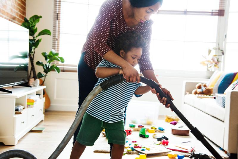 mom and son vacuuming